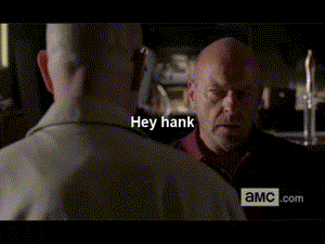 An animated GIF of Hank Shrader and Walter White from Breaking Bad that shows Walter asking Hank about his Rock collection, only to be punched by Hank saying they're minerals